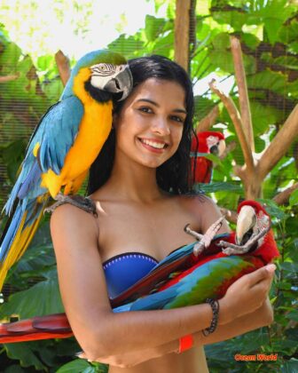 Happy woman with Macaw