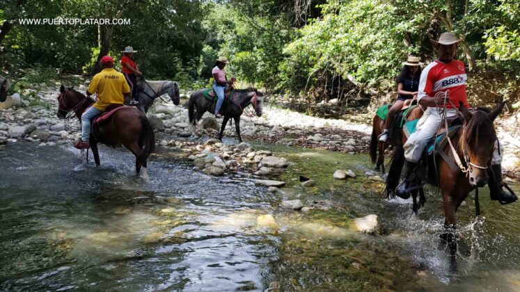 Crossing the river on horseback Puerto Plata DR