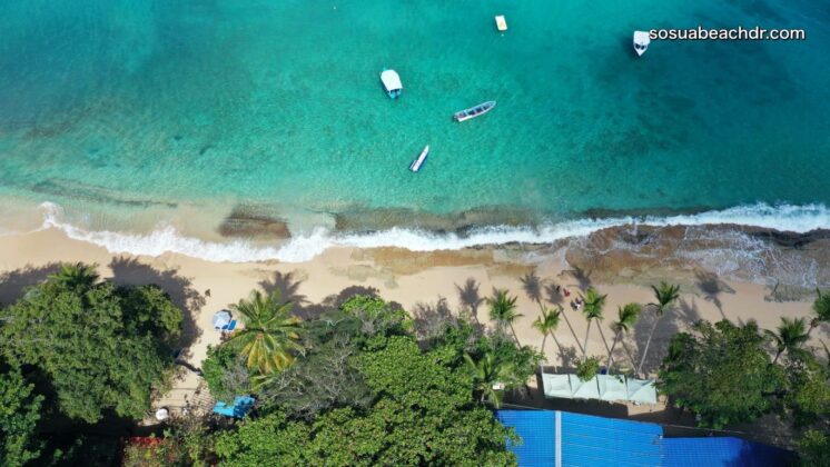 aerial view of the golden sands and turquoise waters of the Sosua beach