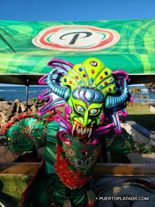 Green cojuelo devil costume at the Puerto Plata Carnival