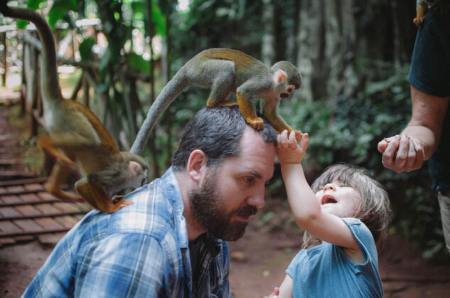 Family engaging the monkeys
