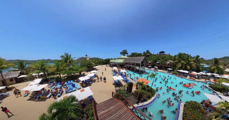 Panorama of Amber Cove pool and loungers area