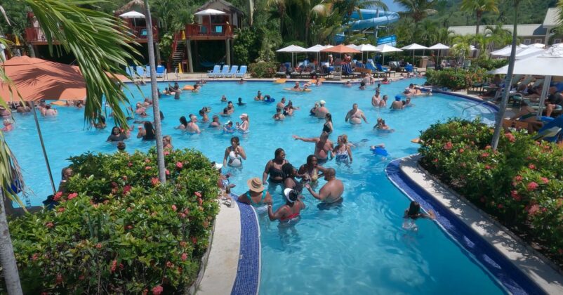 Cruise passengers enjoying a day at the Amber Cove pool